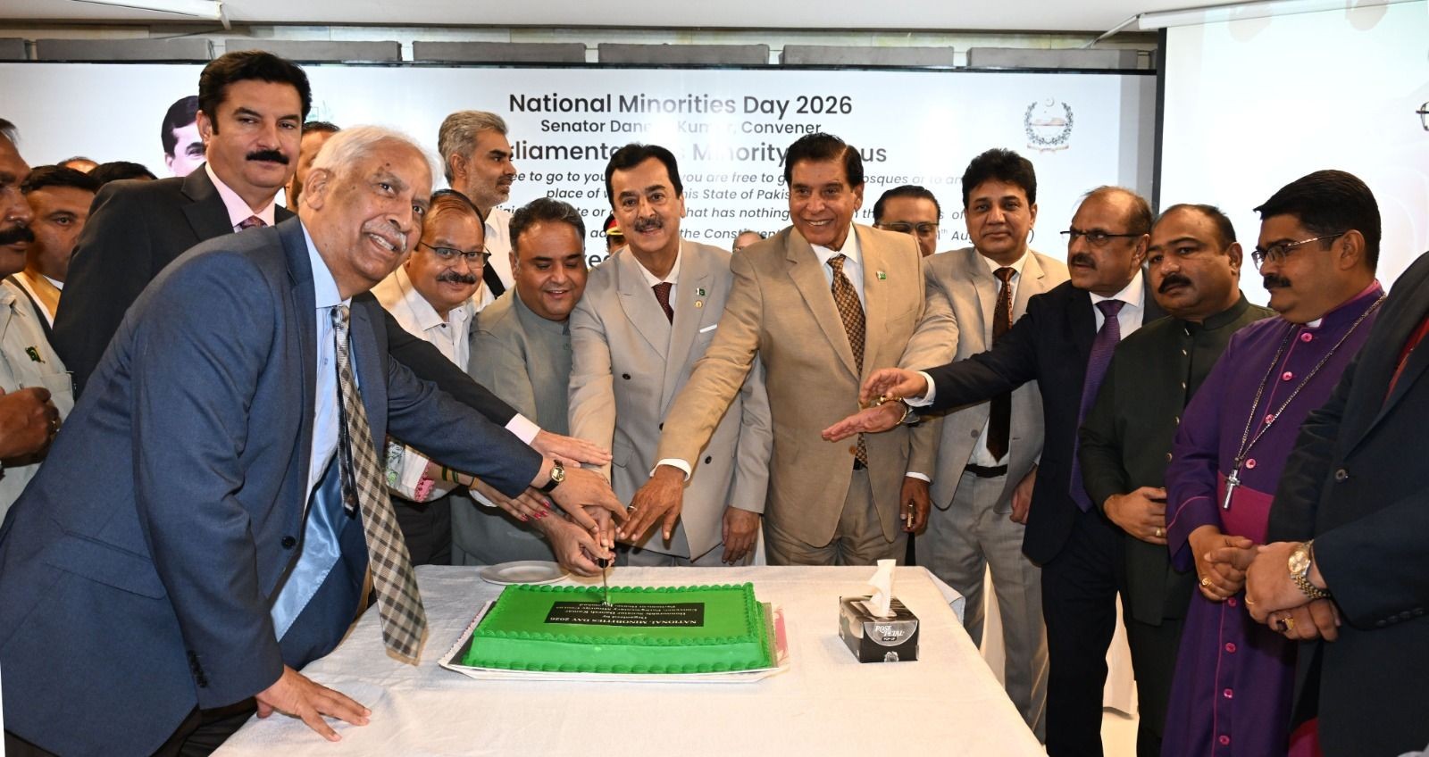 Chairman Senate, Syed Yousaf Raza Gilani along with distinguished guests, cutting a cake during a ceremony held in connection with National Minorities Day at Parliament House, Islamabad