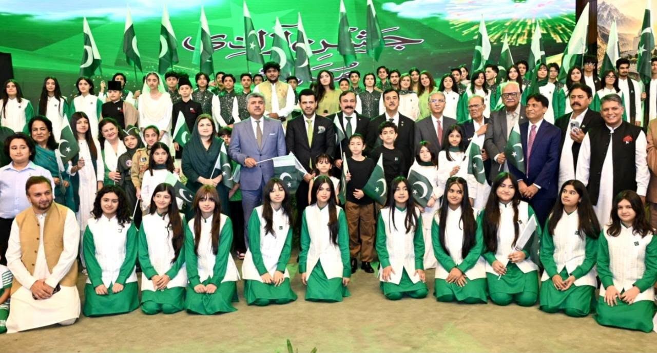 Chairman Senate, Syed Yousaf Raza Gilani in a group photo with Parliamentarians, singers, musicians, and children at the Azadi Cultural Show held at Jinnah Convention Centre, Islamabad